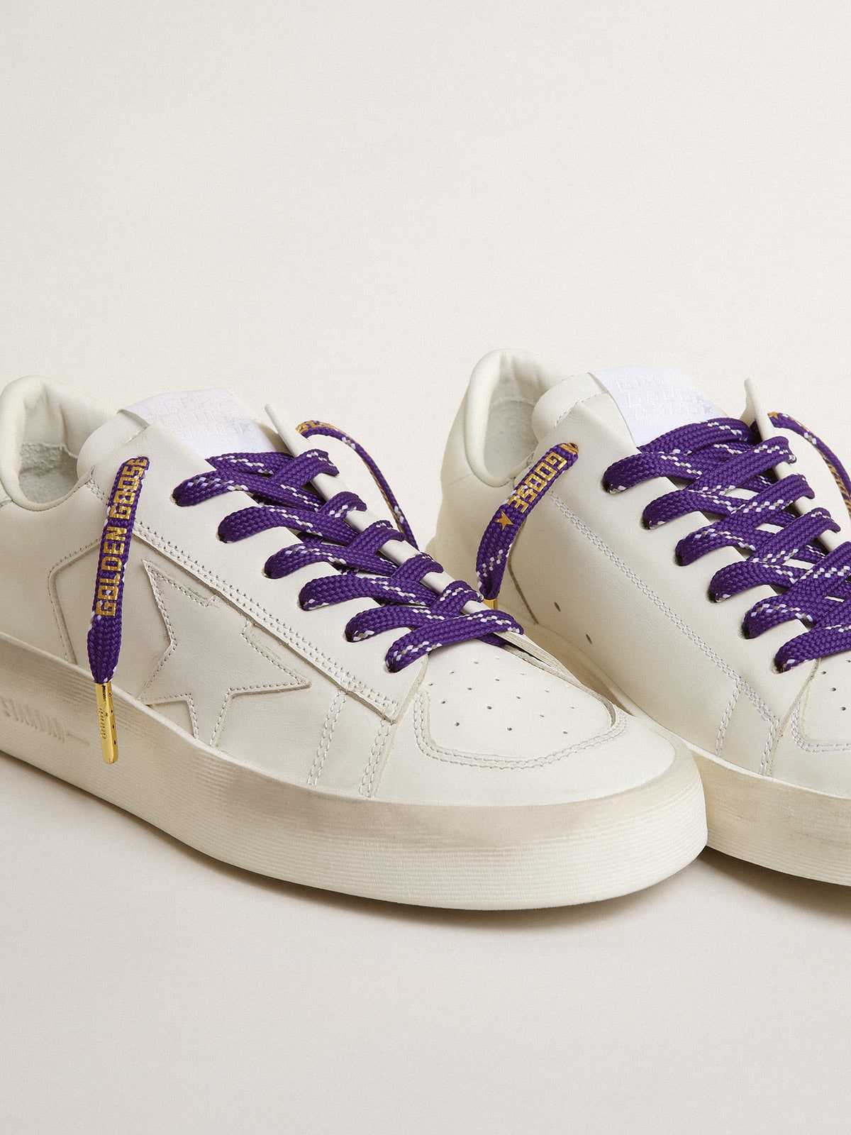 Purple laces with decorations and contrasting gold-colored logo| Golden Goose