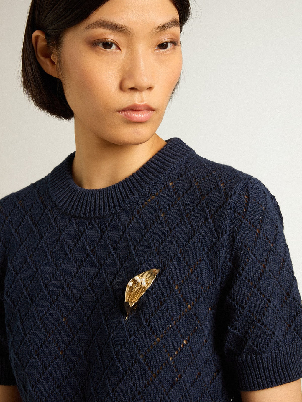 Open-weave knit with midnight blue argyle pattern
