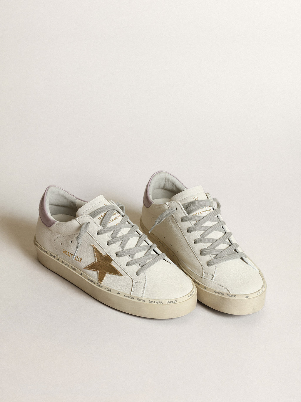 White Hi Star with a gold star and lilac naplak heel tab| Golden Goose
