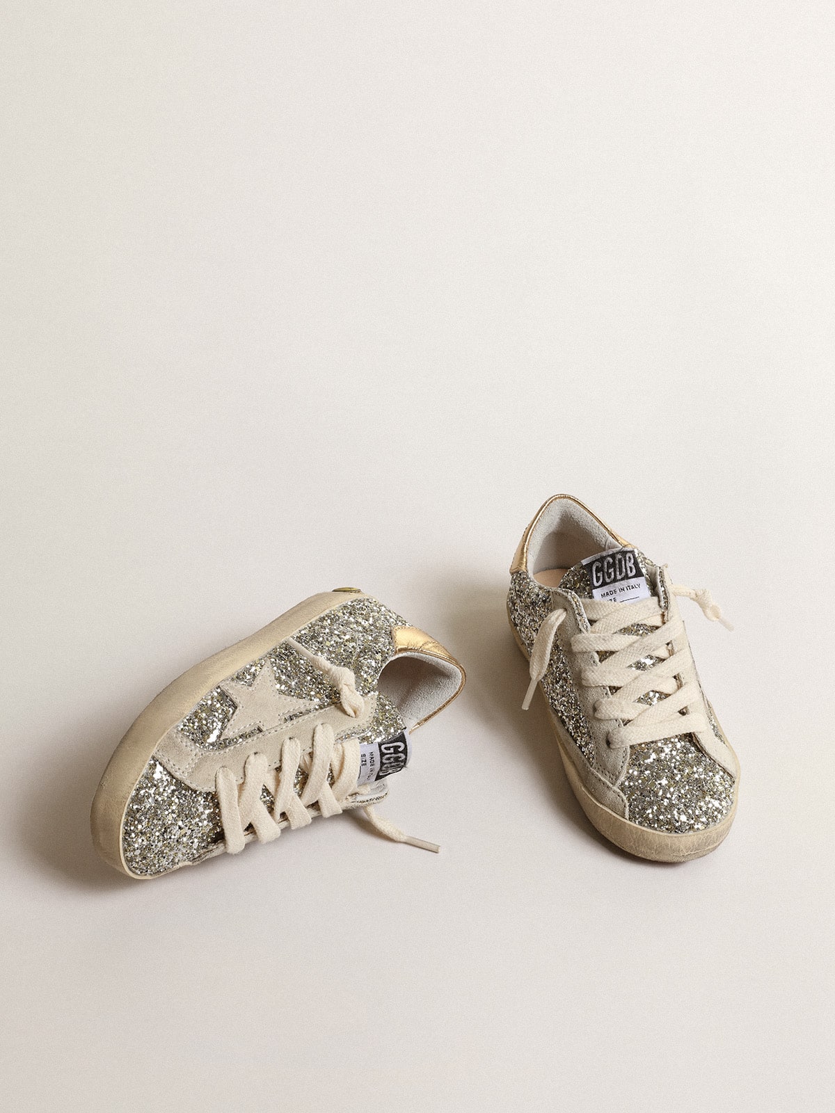 Super-Star Junior in glitter with a suede star and gold heel tab| Golden Goose