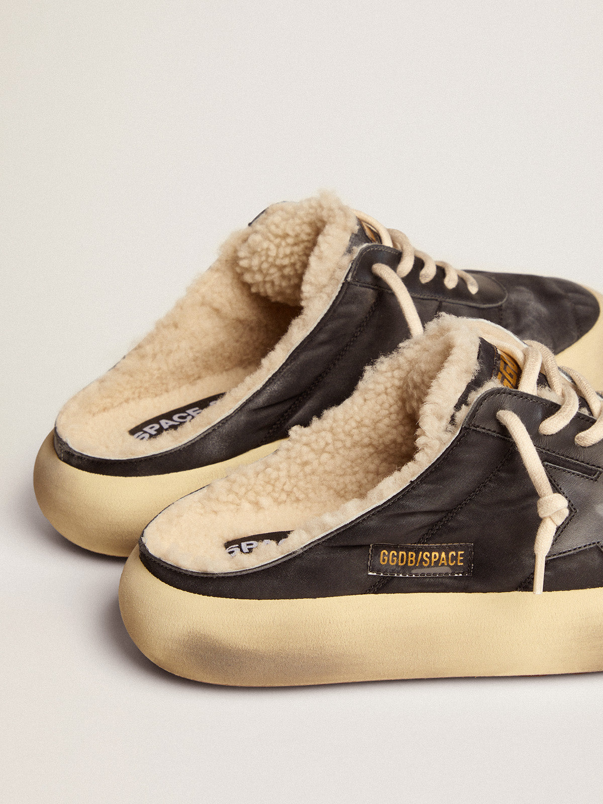 Men's Space-Star Sabot shoes in quilted black nylon with shearling lining| Golden Goose