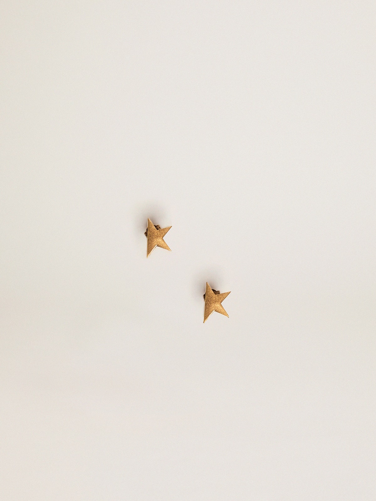 Women's stud earrings in antique gold color| Golden Goose