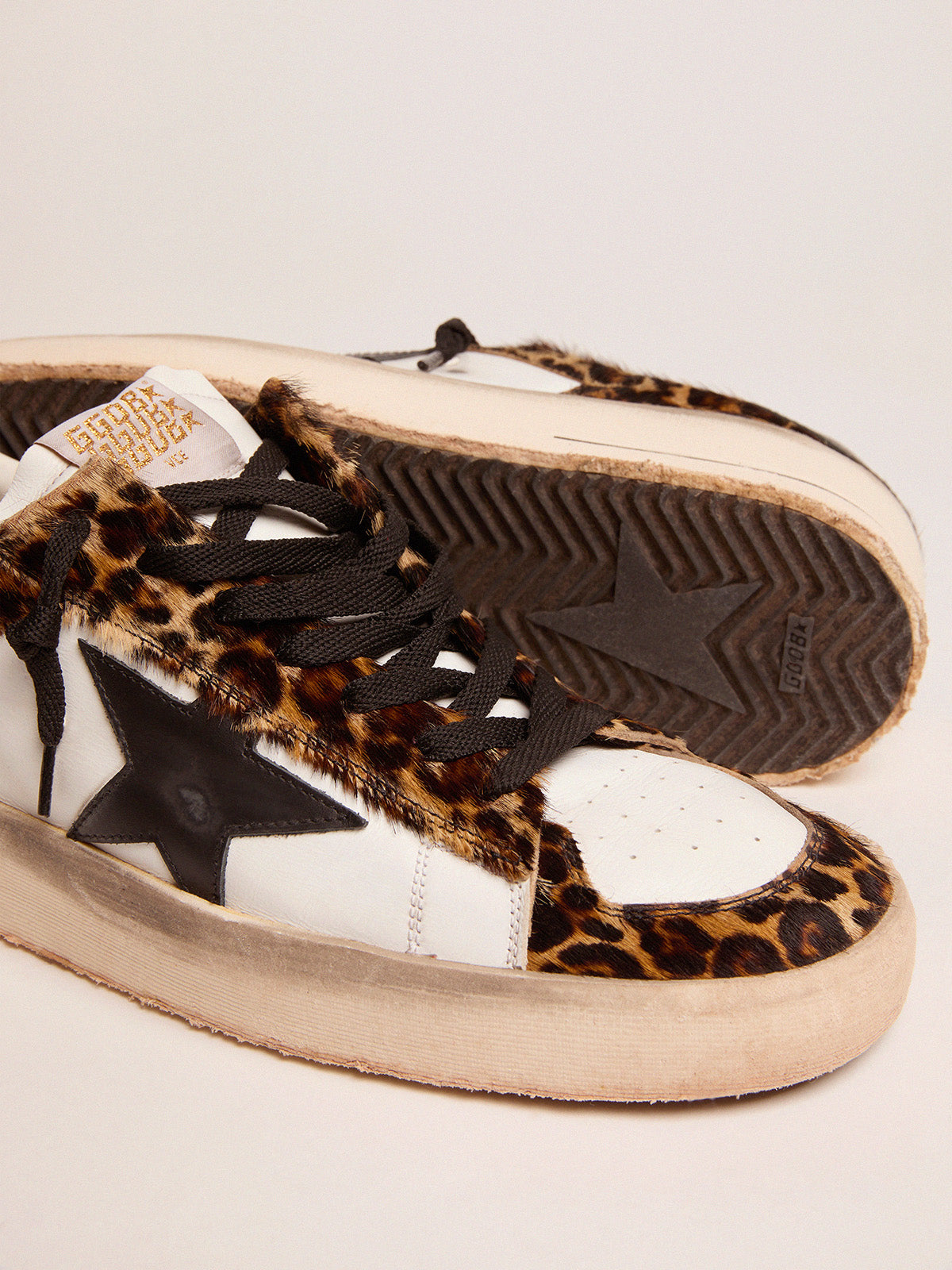 Stardan sneakers in leopard-print pony skin and black star| Golden Goose
