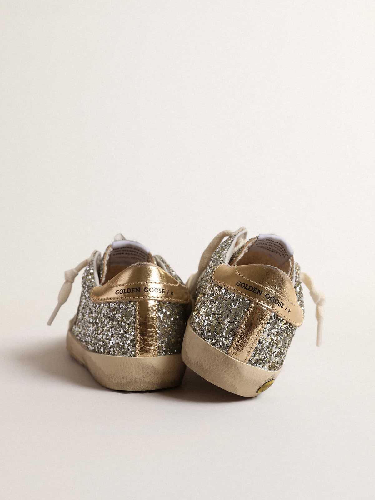 Super-Star Junior in glitter with a suede star and gold heel tab| Golden Goose