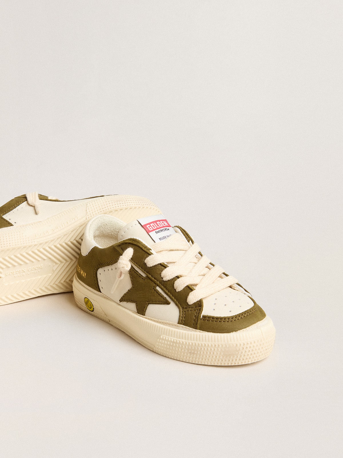 May Young in white and military green leather| Golden Goose