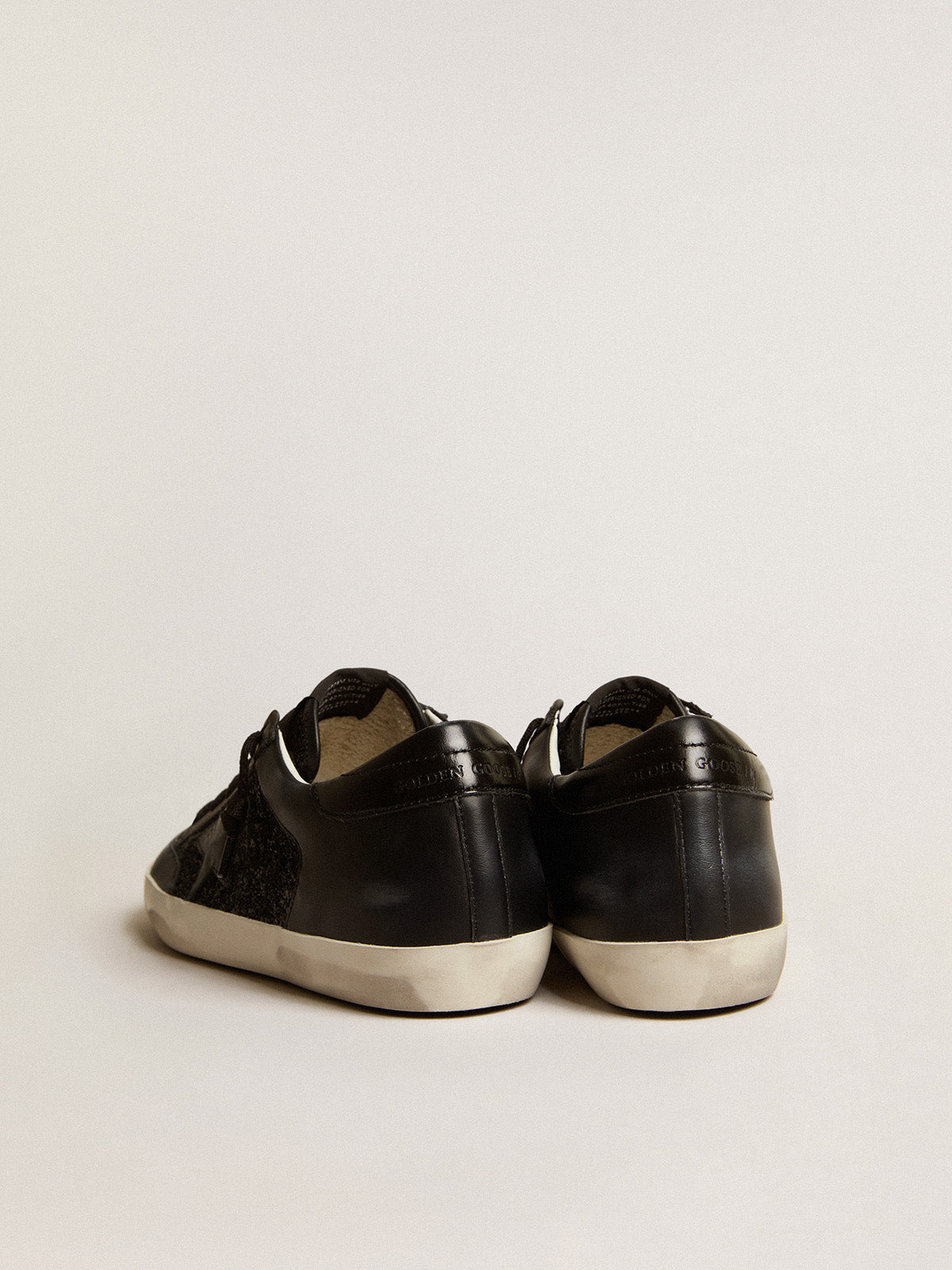 Super-Star in black nappa and glitter with glossy black leather star| Golden Goose