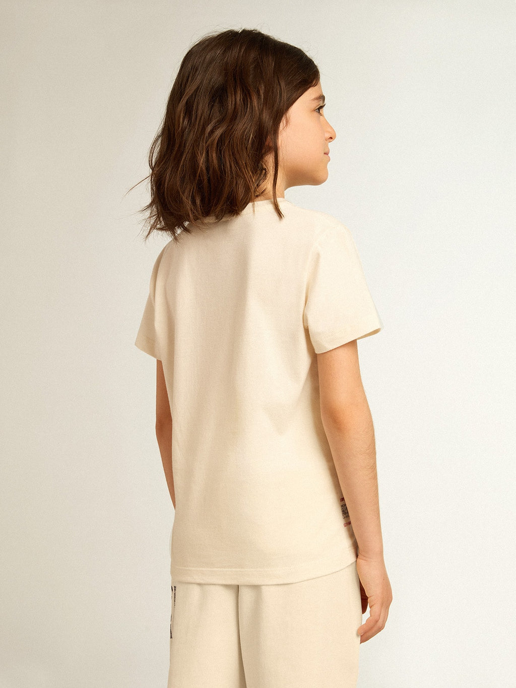 Cotton T-shirt in aged white with faded print at the center| Golden Goose