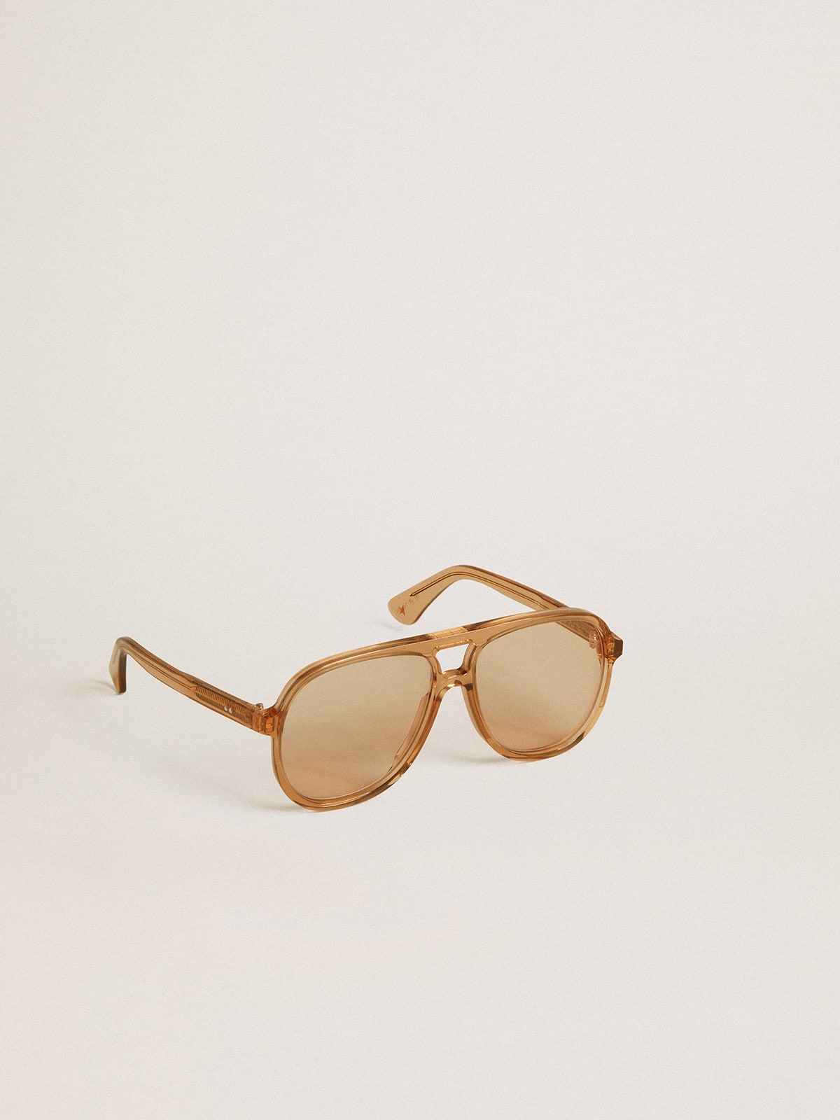 Aviator style sunglasses with honey-colored frame and lenses| Golden Goose