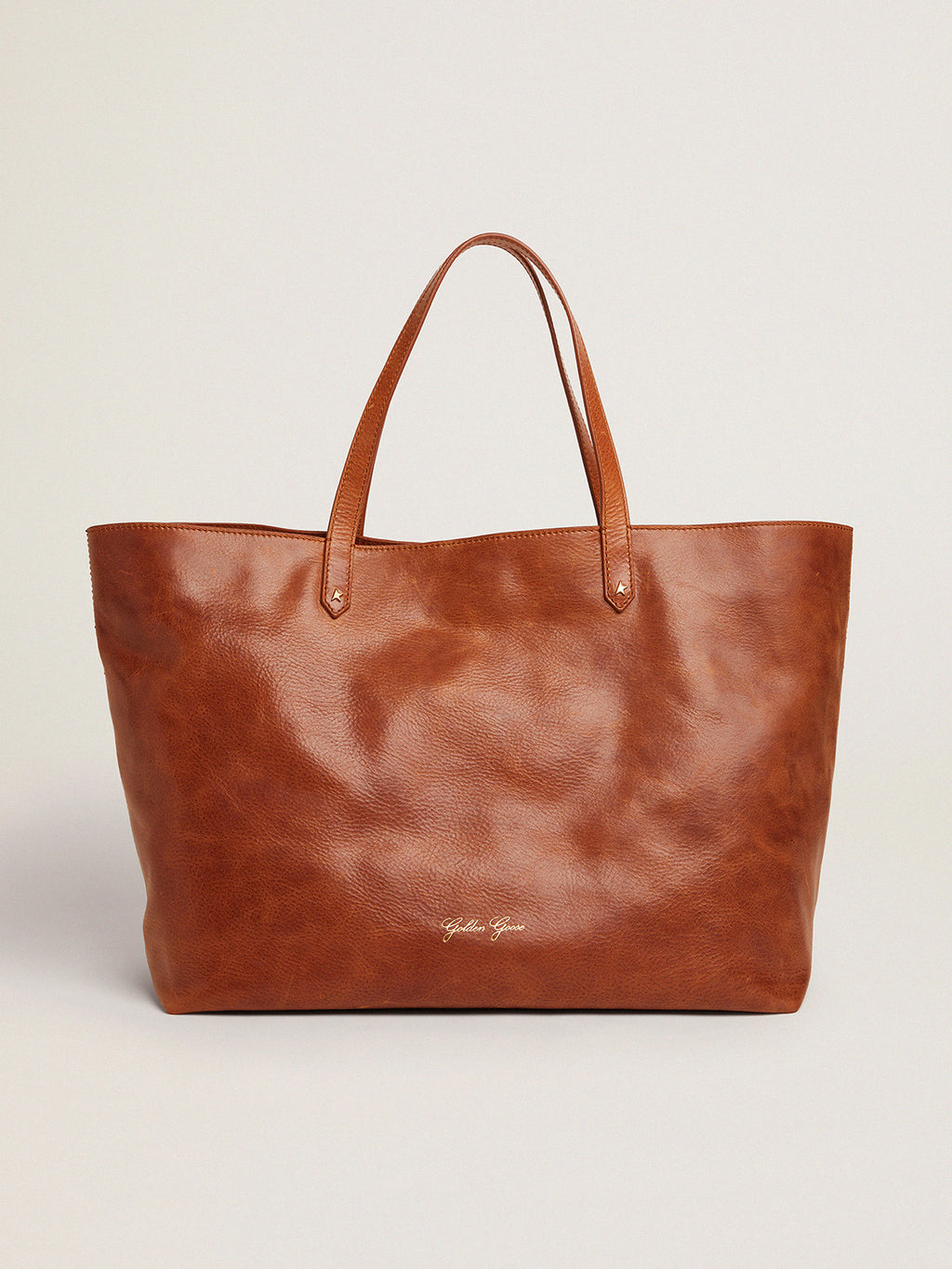 Pasadena Bag in tan-colored glossy leather with gold logo on the front| Golden Goose