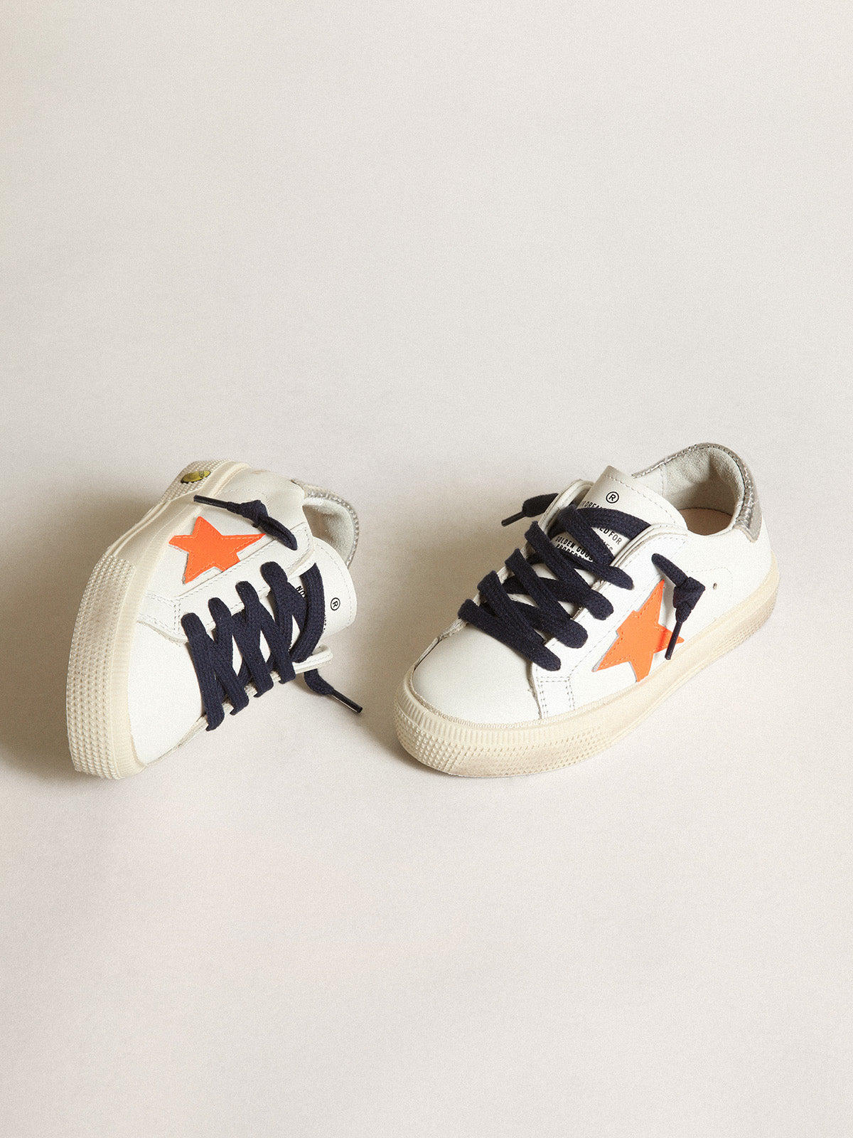 Young May with fluorescent orange leather star and perforated heel| Golden Goose