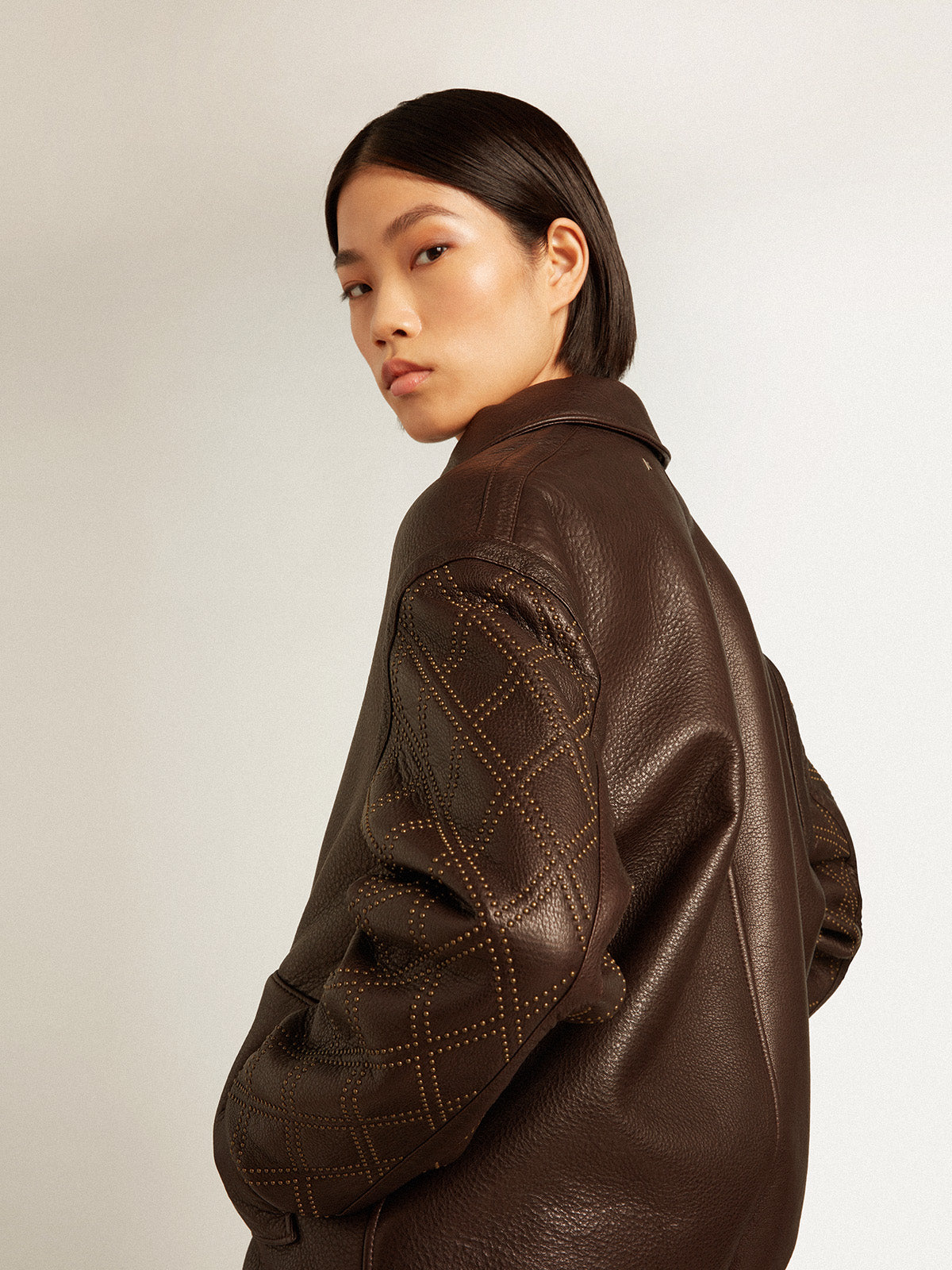 Brown nappa leather jacket with studded sleeves| Golden Goose