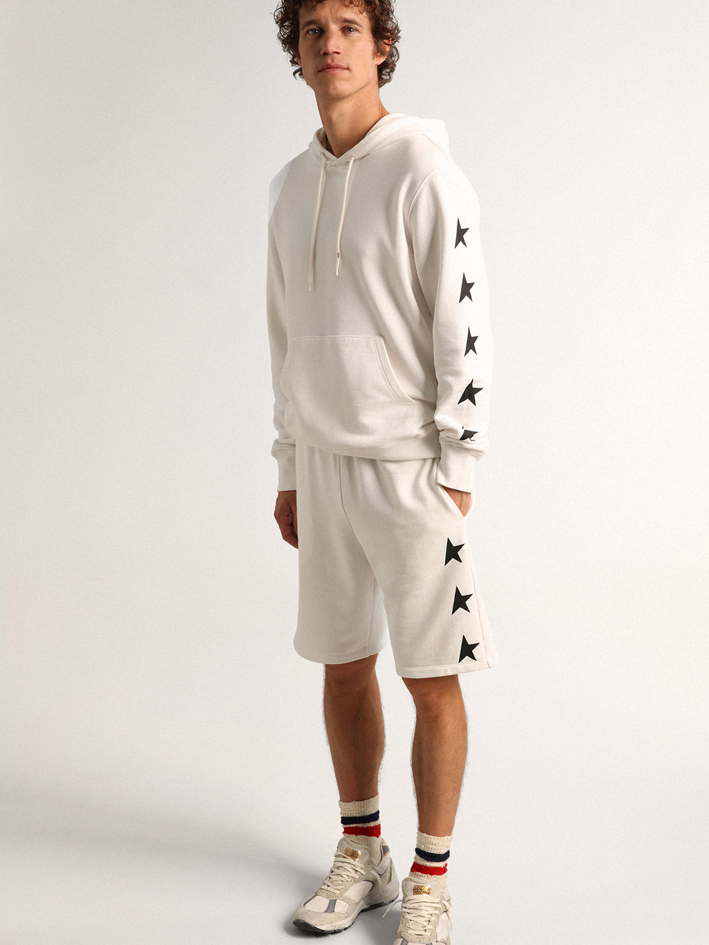 Men's vintage white bermuda shorts with contrasting black stars| Golden Goose