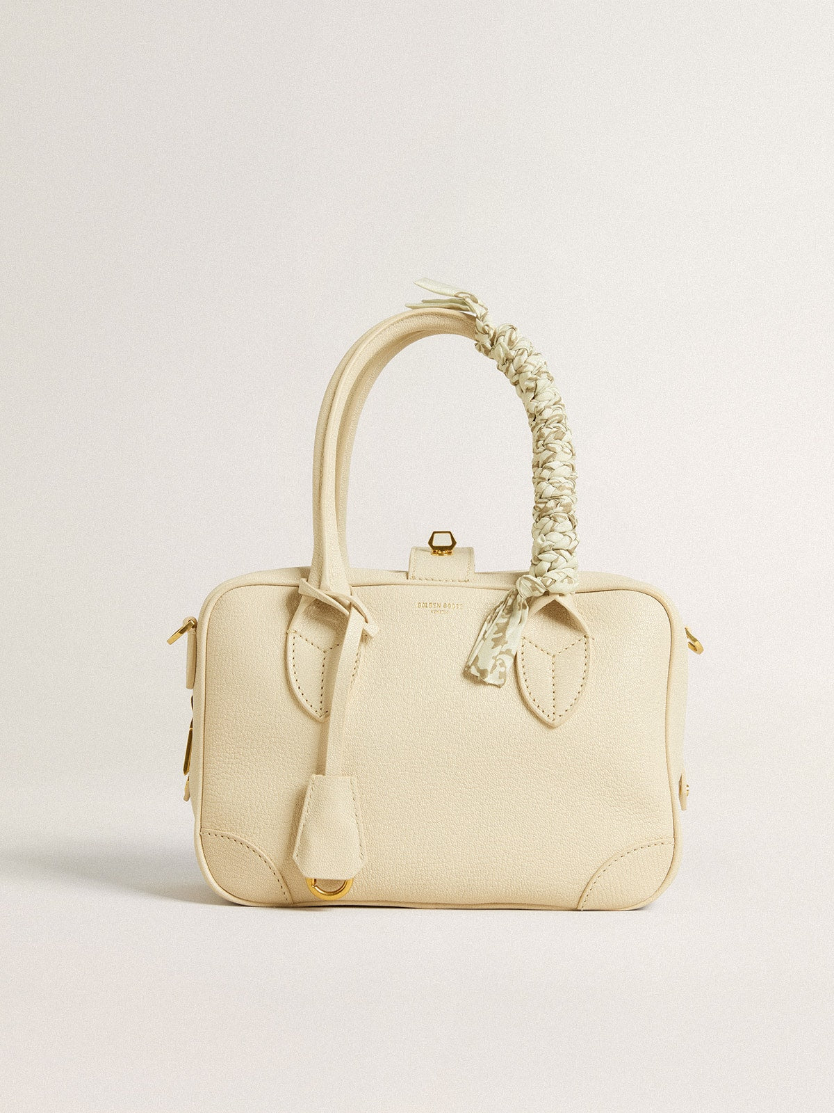 Butter-colored braided fabric charm with brass chain| Golden Goose