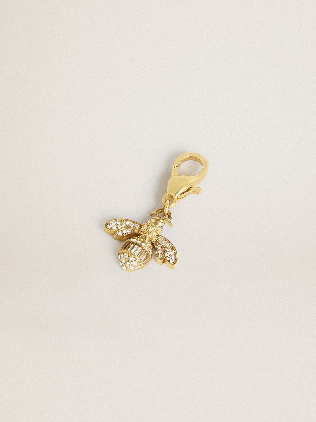 Bee-shaped charm in gold-colored brass with crystals| Golden Goose